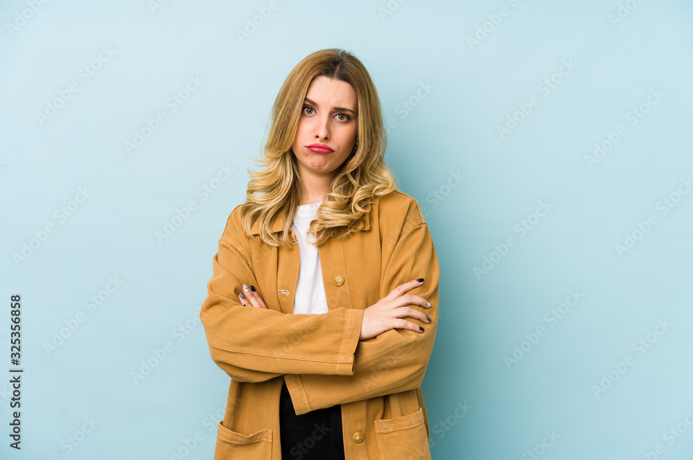 Young blonde pretty woman isolated unhappy looking in camera with sarcastic expression. Young blonde pretty woman isolated unhappy looking in camera with sarcastic expression.