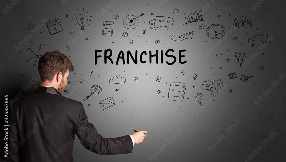 businessman drawing a creative idea sketch with FRANCHISE inscription, business strategy concept businessman drawing a creative idea sketch with FRANCHISE inscription, business strategy concept