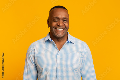 Obraz na plátne Portrait of middle aged african american man with happy smile