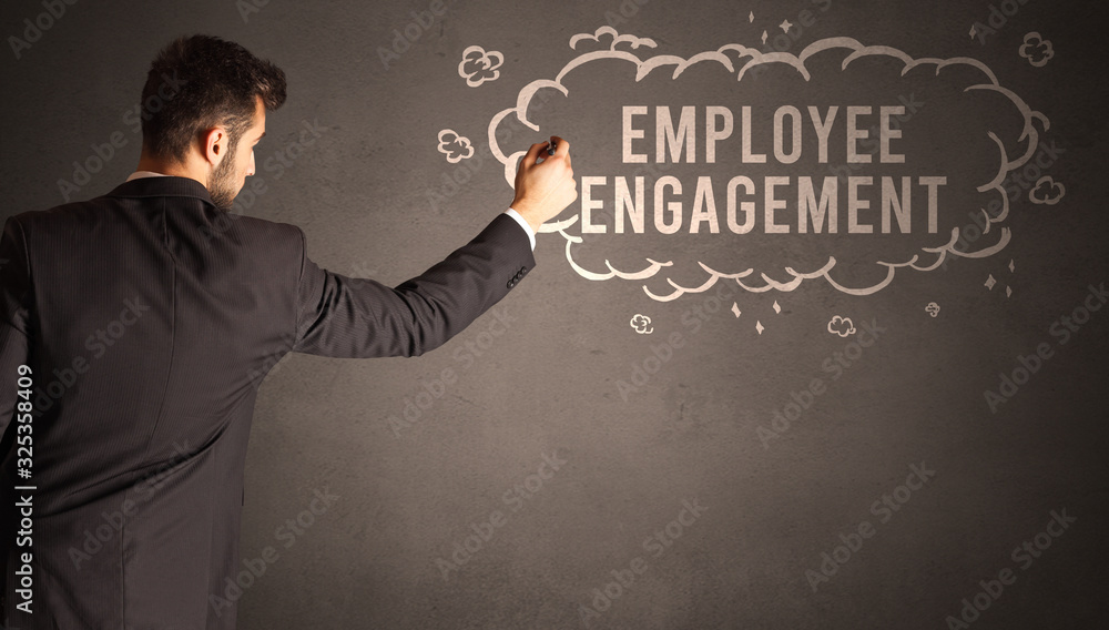 businessman drawing a cloud with EMPLOYEE ENGAGEMENT inscription inside, modern business concept businessman drawing a cloud with EMPLOYEE ENGAGEMENT inscription inside, modern business concept