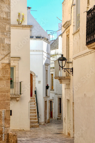 Fototapeta Naklejka Na Ścianę i Meble -  Street in the old town of Locorotondo, Bari, Puglia, Italy