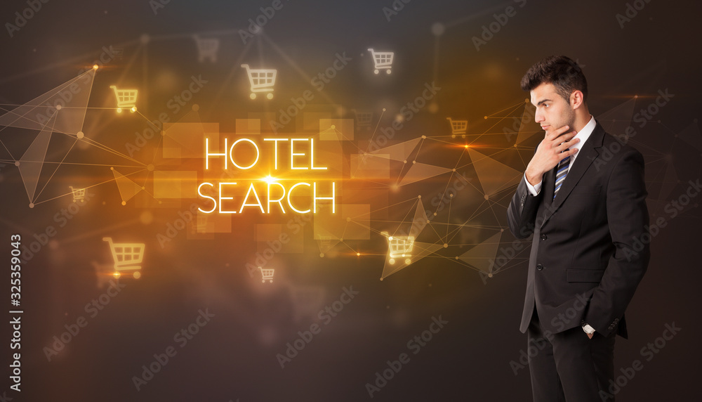 Businessman with shopping cart icons and HOTEL SEARCH inscription, online shopping concept Businessman with shopping cart icons and HOTEL SEARCH inscription, online shopping concept