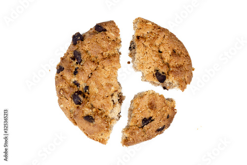 Close up of chocolate chip cookie pieces with crumbs isolated on white background.