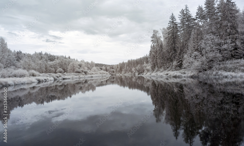 infrared photo: landscape with river, and amazing beautiful trees and glare infrared photo: landscape with river, and amazing beautiful trees and glare