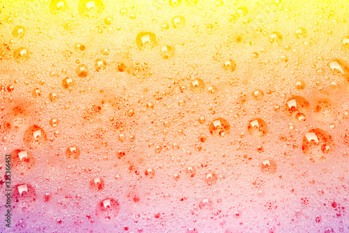 Rainbow foam baubles as background.