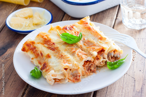 Baked cannelloni with minced meat with bechamel sauce, selective focus