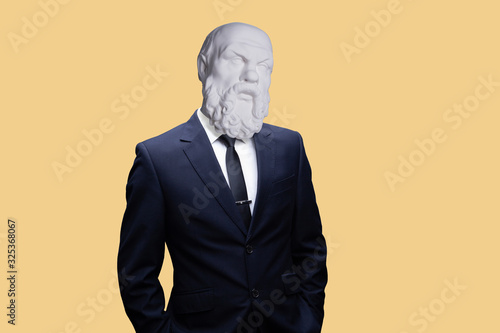 Modern art collage. Concept portrait a  businessman. Gypsum head of of Socrates. Man in suit. photo