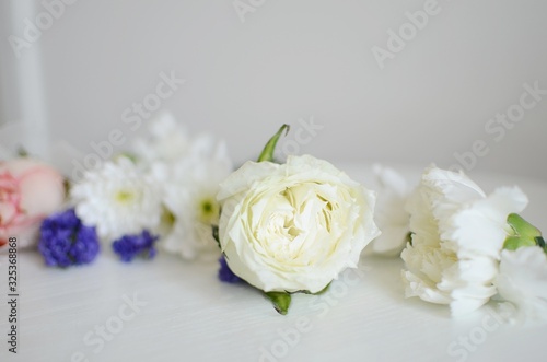 Beautiful Flowers on a white Table, Background