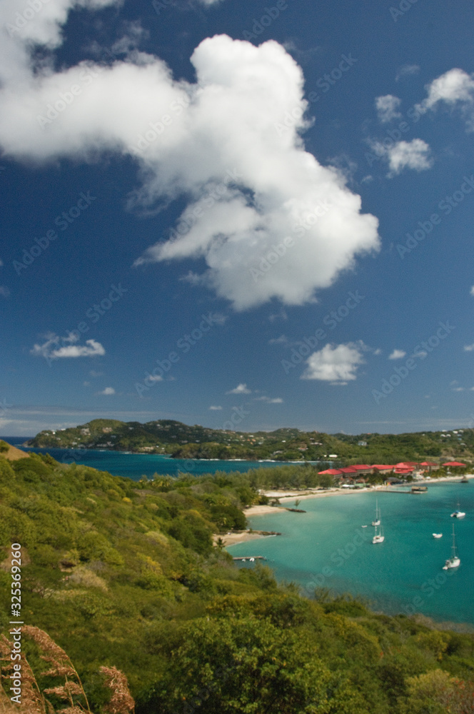 Landscape view from altitude of Pigeon Island, St. Lucia with azure sky and waters dotted with sailboats