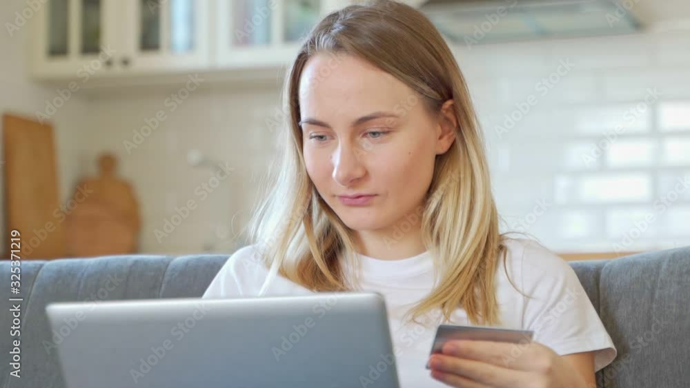 On-line shopping, banking and technology concept - smiling woman with laptop computer and credit card. On-line shopping, banking and technology concept - smiling woman with laptop computer and credit card.