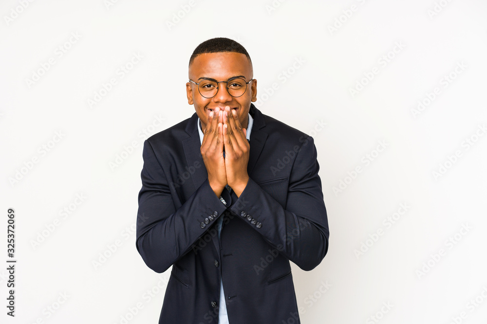 Young business latin man isolated on white background laughing about something, covering mouth with hands. Young business latin man isolated on white background laughing about something, covering mouth with hands.