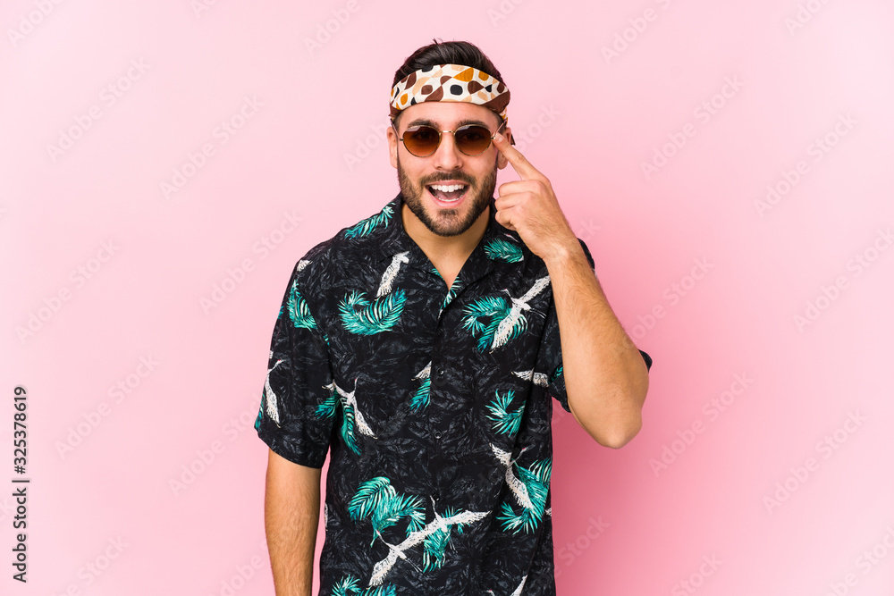 Young hipster man isolated showing a disappointment gesture with forefinger. Young hipster man isolated showing a disappointment gesture with forefinger.