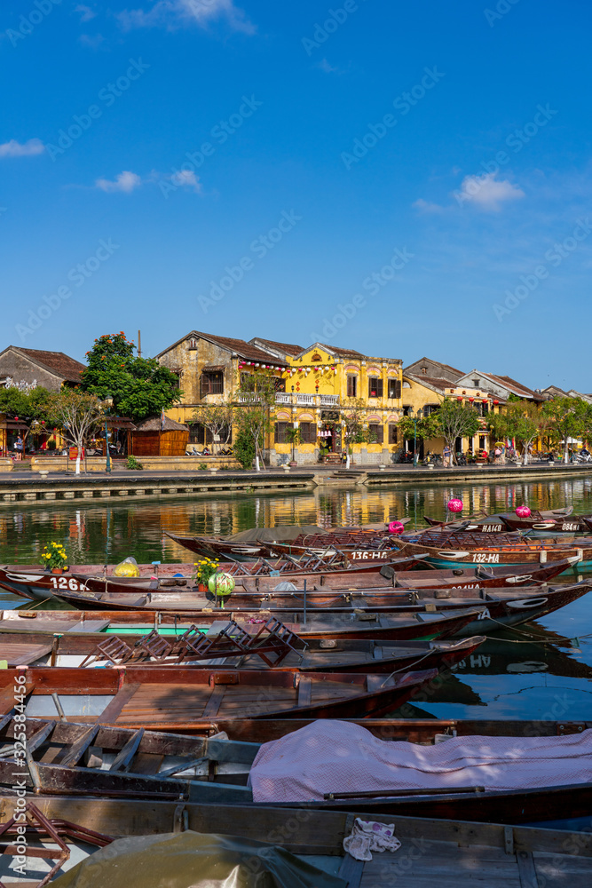 City view of Hoi an old town with passenger boats
