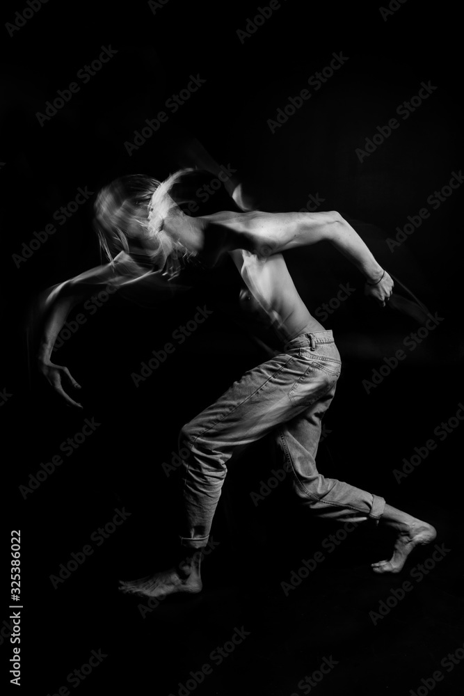 Dancing emotional portrait of naked torso handsome sporty man wearing jeans. Ghost. abstract conceptual artistic view. representation of subconscious feelings, doubts and thoughts. Black and white