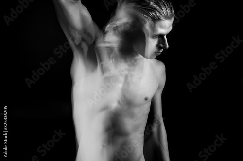 attractive young naked man looking side. abstract artistic portrait of handsome blonde man. Emotional creative artistic long exposure black and white series of portraits. Dark side thoughts