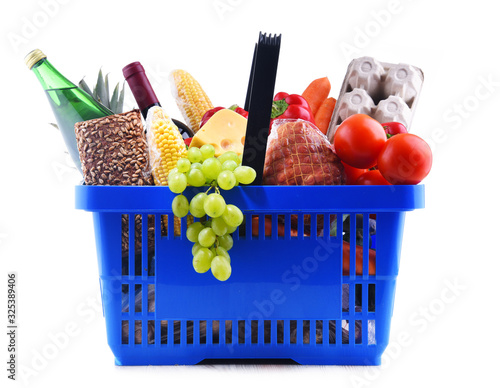 Plastic shopping basket with assorted grocery products
