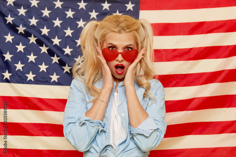 American girl. Portrait of Happy of young surprised woman on USA