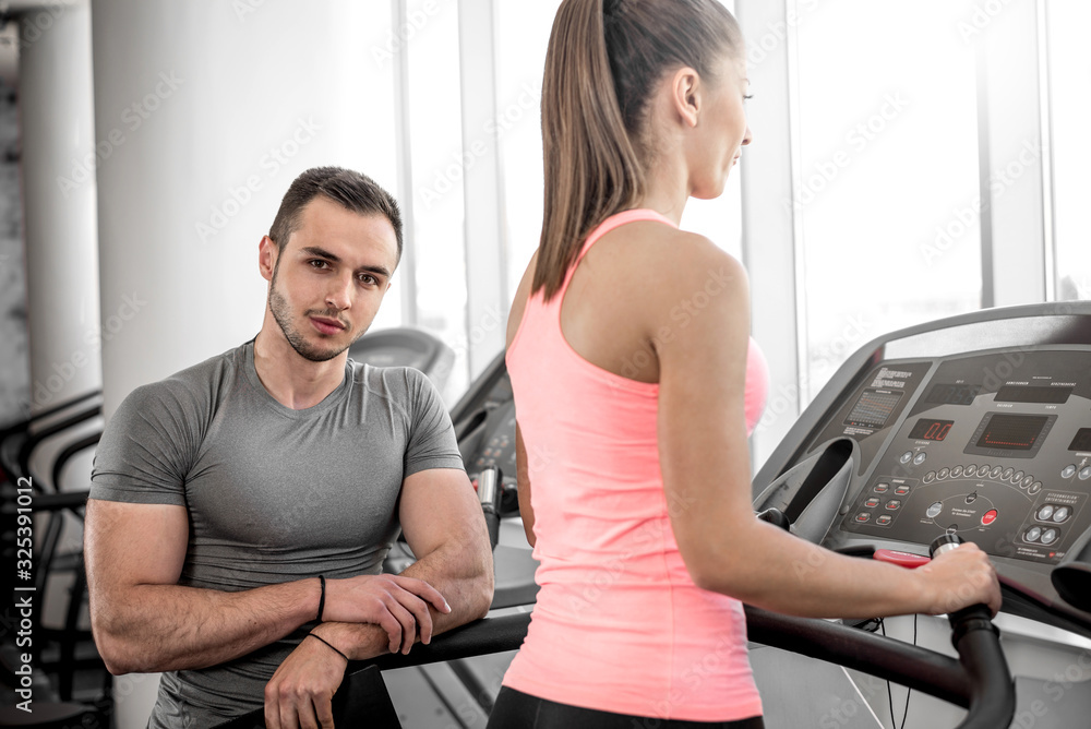 Treadmill walk with personal trainer.