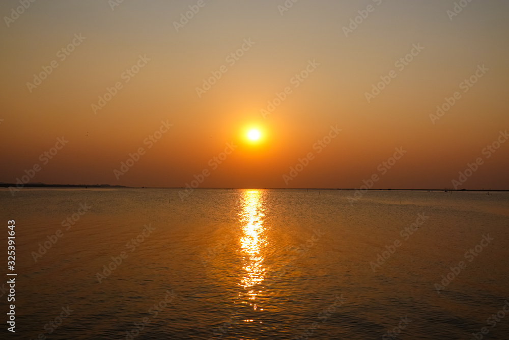 The sunset on the sea in the summer