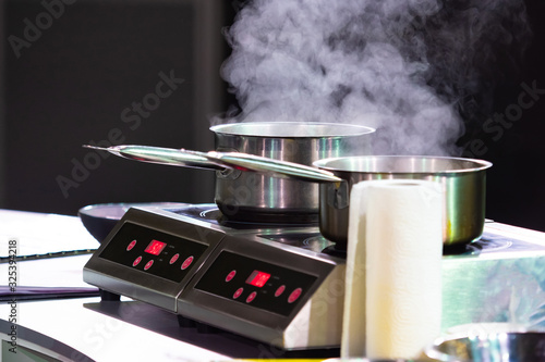 Two dippers on the stove in...