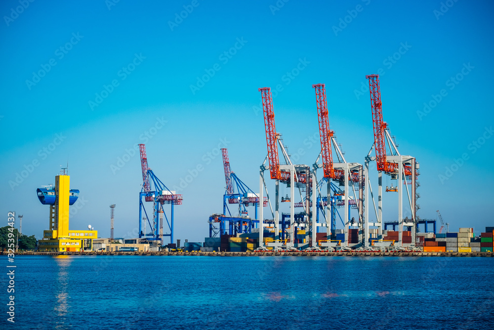 Black Sea trade port, containers loading by crane. International marine shipping. Container import export logistic, cargo harbor view, water transport. Industrial freight. Seaport cranes panorama. Black Sea trade port, containers loading by crane. International marine shipping. Container import export logistic, cargo harbor view, water transport. Industrial freight. Seaport cranes panorama.