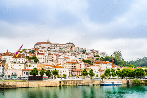 View of medieval city centre of Coimbra across Mondego river, Portugal