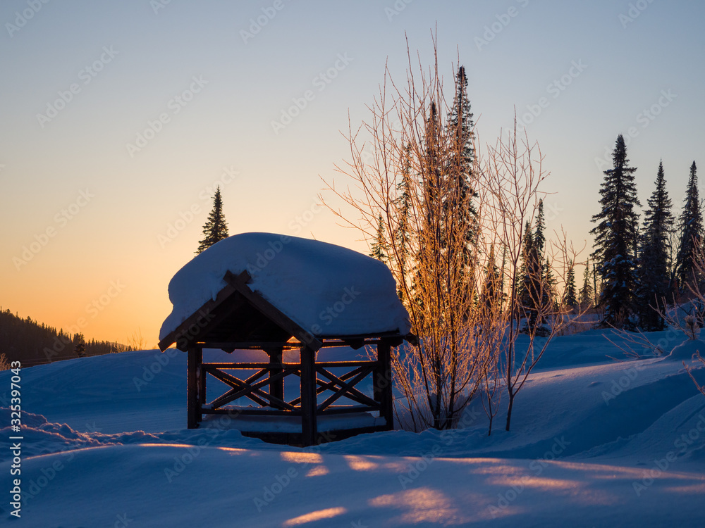 Dawn in the ski resort Mountain Salanga. Lyrical winter landscape. Frosty morning in Siberia Dawn in the ski resort Mountain Salanga. Lyrical winter landscape. Frosty morning in Siberia