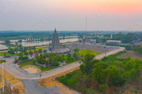 Aerial view of Wat Panyanantaram at sunset, a Buddhist temple in Pathum Thani City, Thailand. Thai architecture buildings background in travel trip concept. Buddhism religion. Tourist attraction. photo