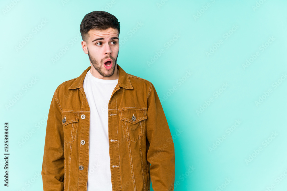 Young handsome man being shocked because of something she has seen. Young handsome man being shocked because of something she has seen.