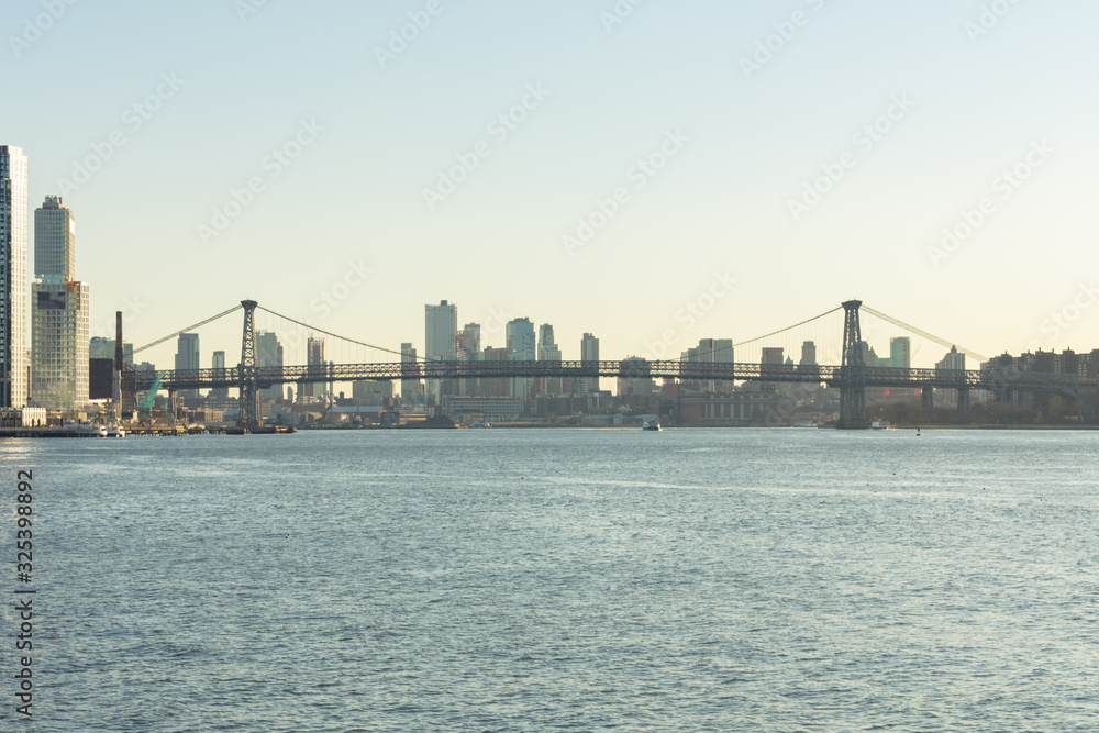 Williamsburg Bridge connecting Manhattan to Brooklyn New York over the East River before Sunset