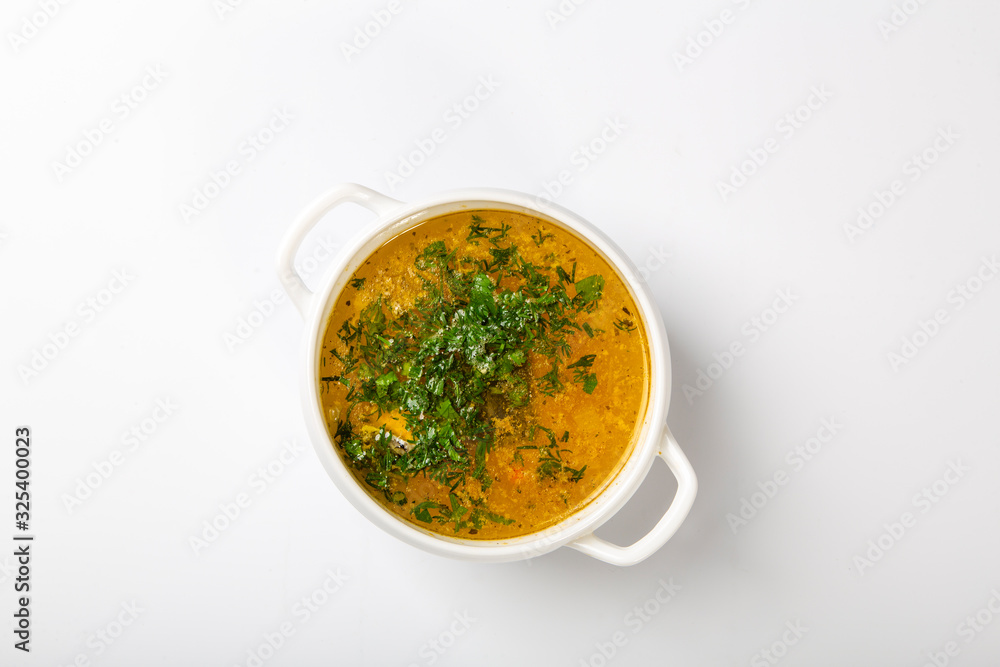 soup of sturgeon. Ear in a white high plate with two handles. Top with parsley soup of sturgeon. Ear in a white high plate with two handles. Top with parsley