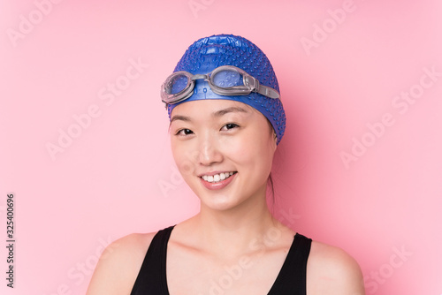 Young japanese swimmer woman face closeup isolated © Asier