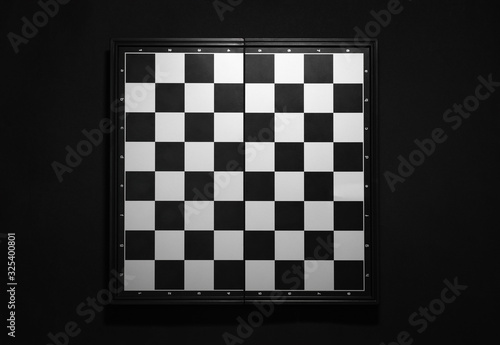 empty chess board on black Fototapeta