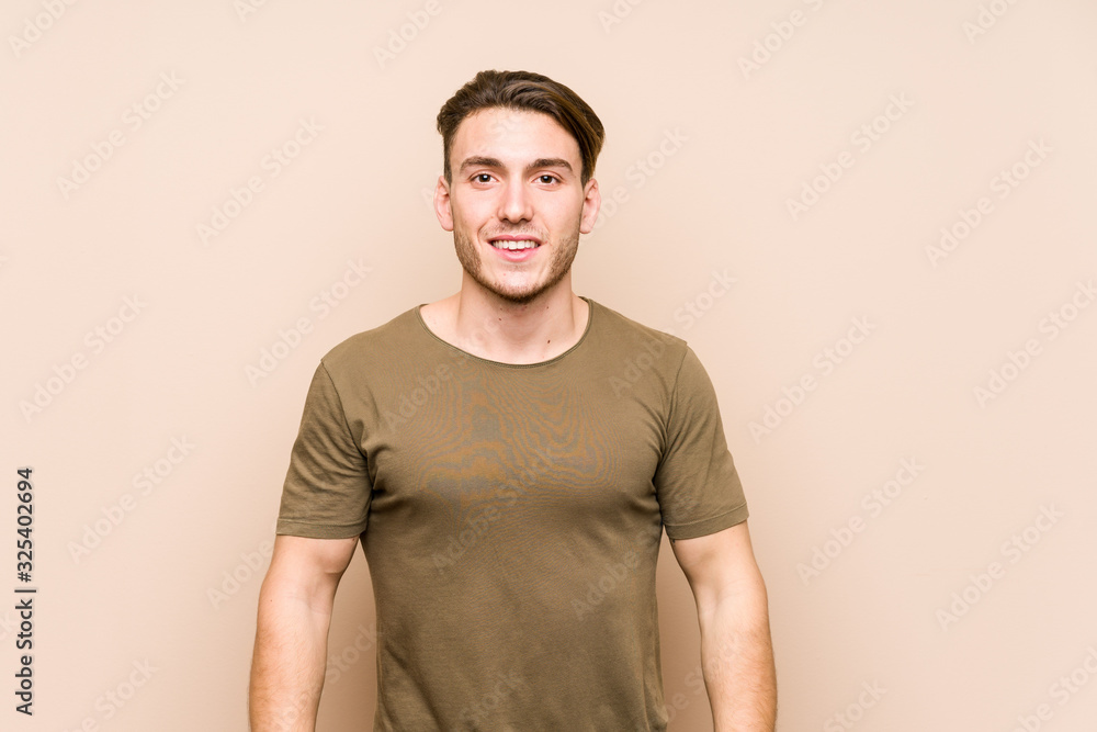 Young caucasian man posing isolated happy, smiling and cheerful. Young caucasian man posing isolated happy, smiling and cheerful.