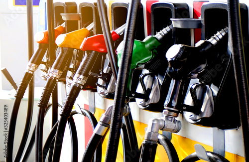 colorul fuel gasoline dispenser with sun flare background