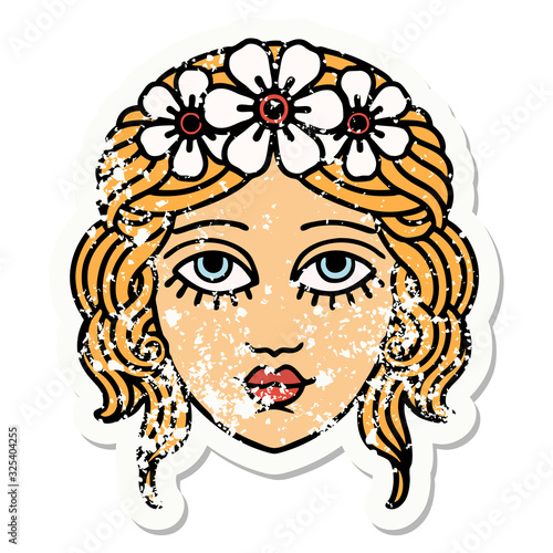 traditional distressed sticker tattoo of female face with crown of flowers