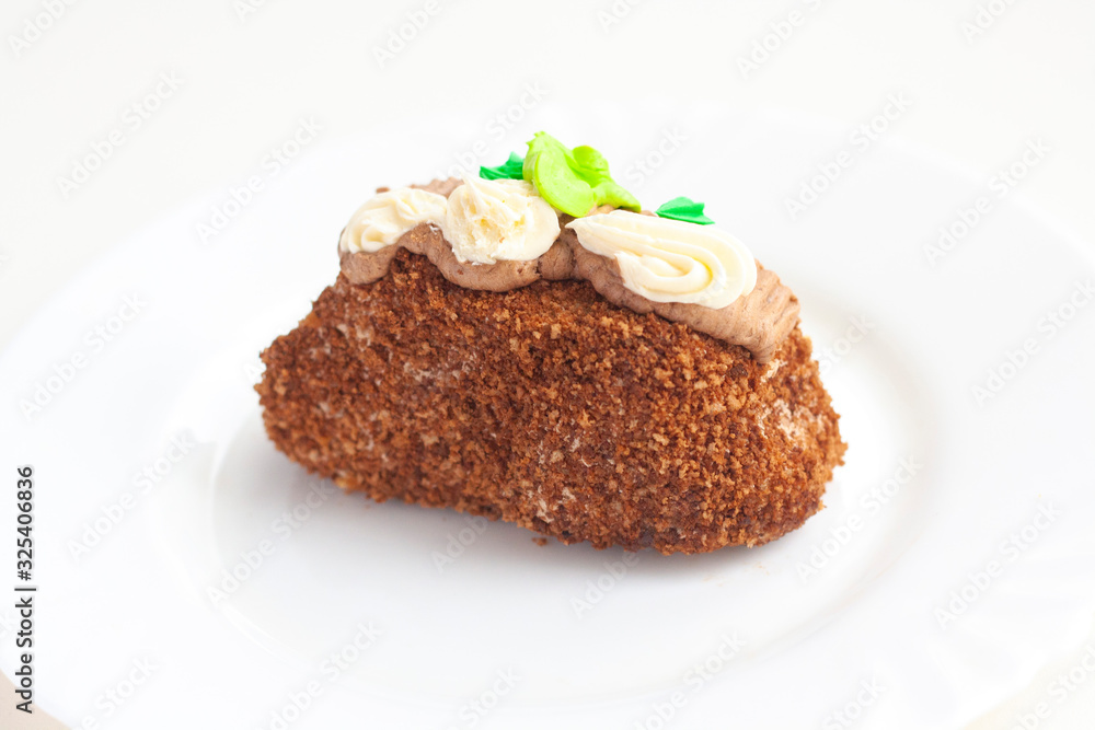 A piece of cake topped with cream A piece of cake topped with cream