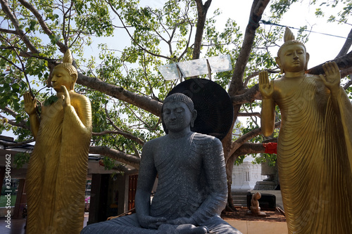 Colombo, Sri Lanka - 20th March 2018 : Seema Malakaya which is Buddhism Temple and statue of the Buddha in Colombo, Sri Lanka photo