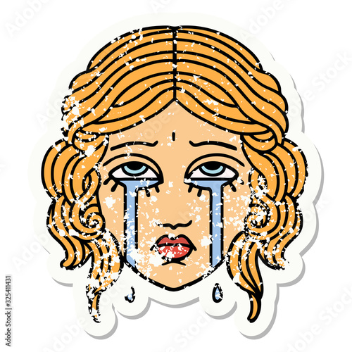 traditional distressed sticker tattoo of female face crying