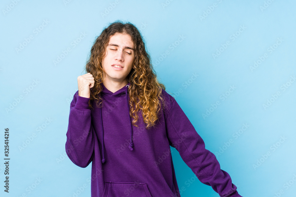 Long hair man posing isolated dancing and having fun.