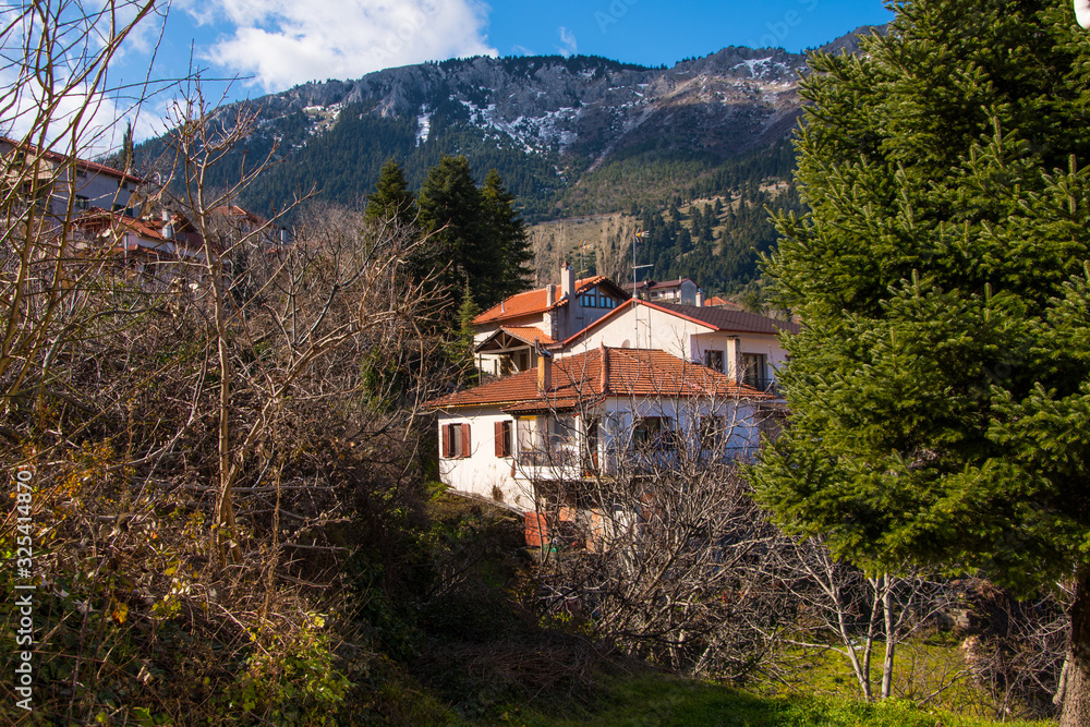 View of traditional architecture of Agoriani or Eptalofos village, a winter destination near Parnassos mountain in Greece View of traditional architecture of Agoriani or Eptalofos village, a winter destination near Parnassos mountain in Greece