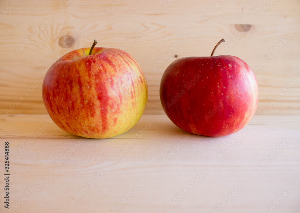 red tasty Sicilian apples on the on the wooden background, top view. Healthy lifestyle, vitamins and Mediterranean diet. red tasty Sicilian apples on the on the wooden background, top view. Healthy lifestyle, vitamins and Mediterranean diet.