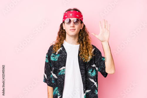Young hippie caucasian man isolated smiling cheerful showing number five with fingers.