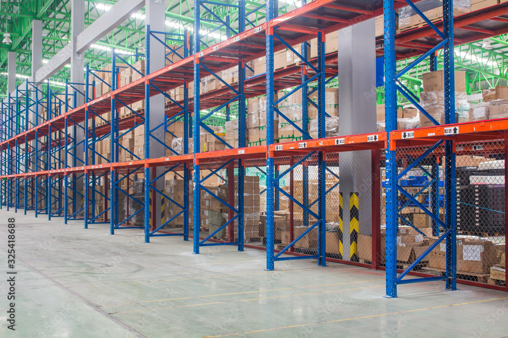 The empty rows of shelves with boxes in warehouse. The empty rows of shelves with boxes in warehouse.