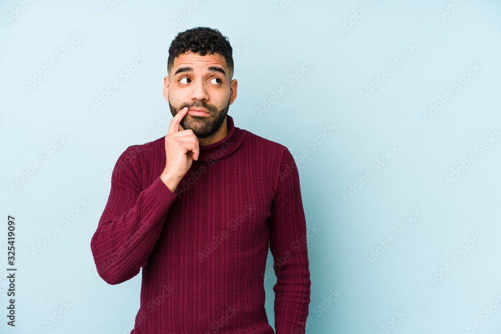 Young mixed race arabic man isolated looking sideways with doubtful and skeptical expression. Young mixed race arabic man isolated looking sideways with doubtful and skeptical expression.