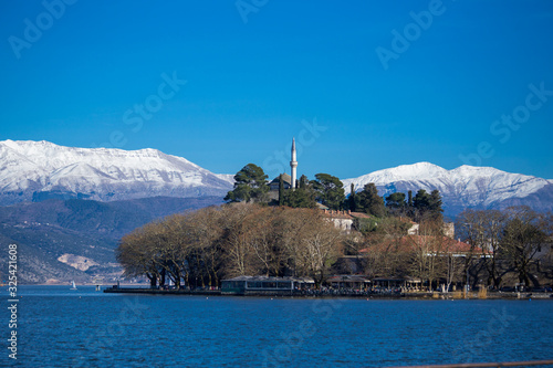 ioannina city lake pamvotis in winter season greece photo