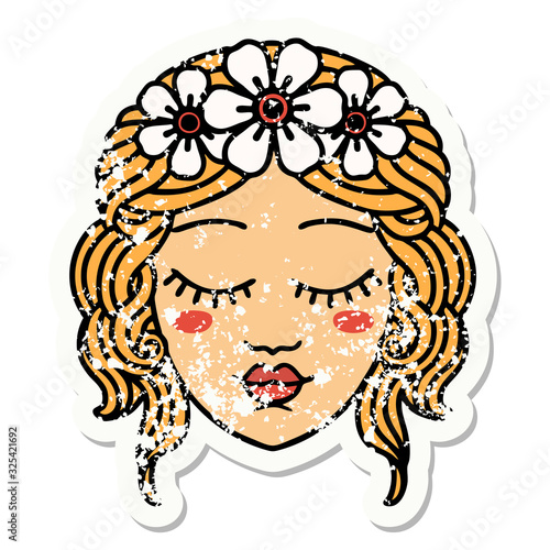 traditional distressed sticker tattoo of female face with eyes closed
