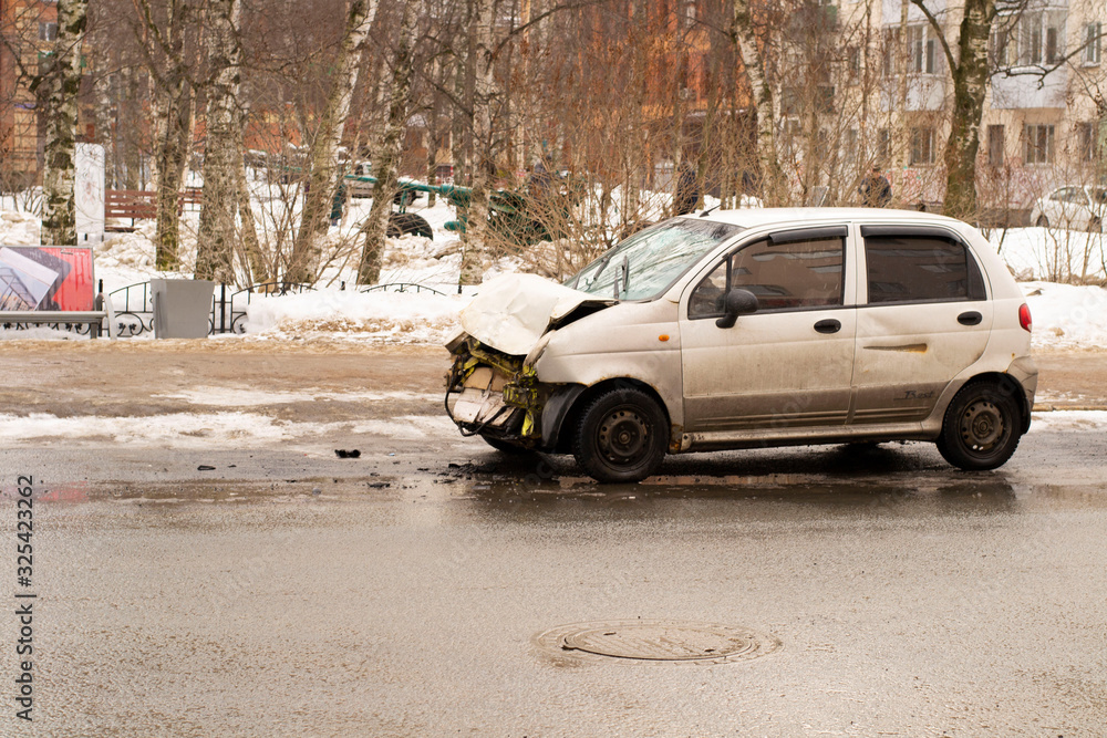 Auto accident involving two cars on a city street