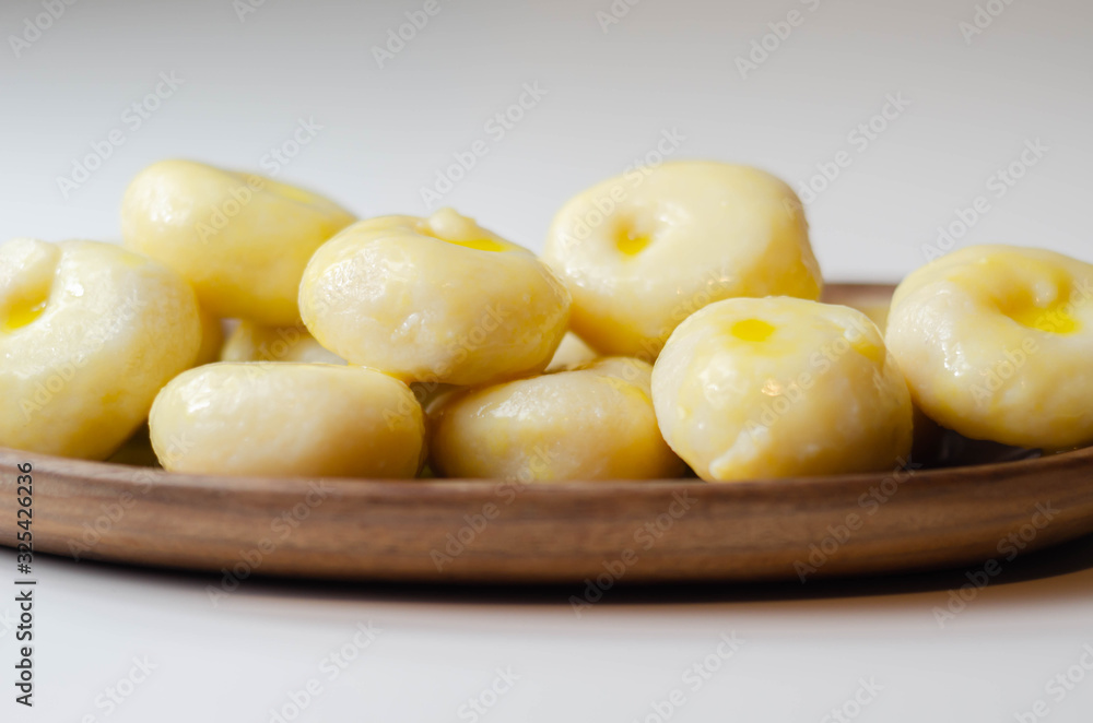 Traditional Silesian dumplings with a hole, homemade noodles served with butter Traditional Silesian dumplings with a hole, homemade noodles served with butter
