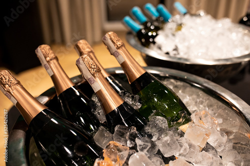Foto Bottles of champagne in cooler